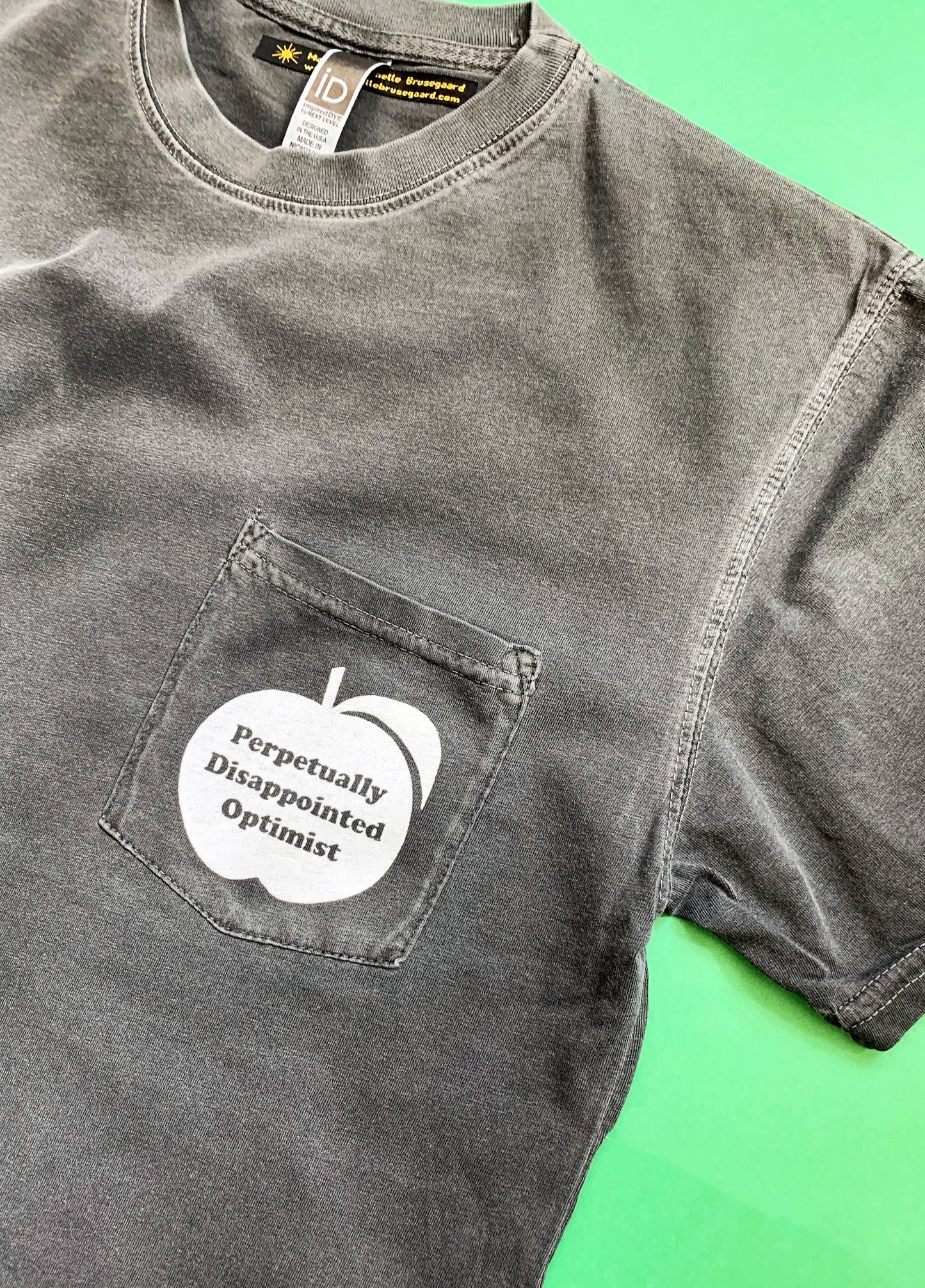 Perpetually Disappointed Optimist Pocket Tee